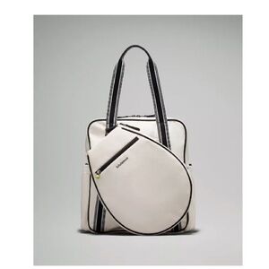 Lululemon 3-in-1 white and black canvas tennis bag.